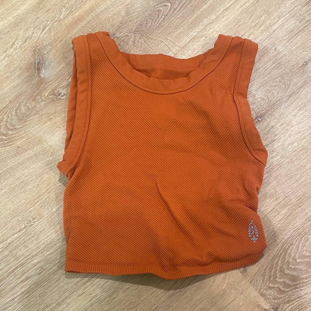 Free people movement muscle tank size XS/S color orange reddish